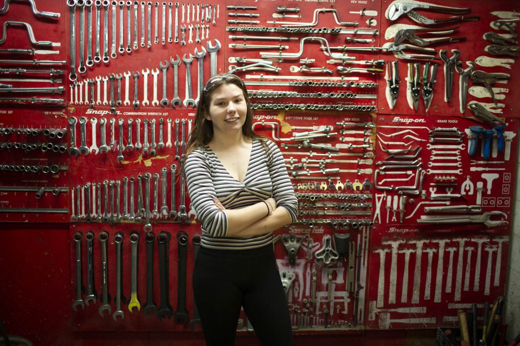 Woman in a mechanic workshop.