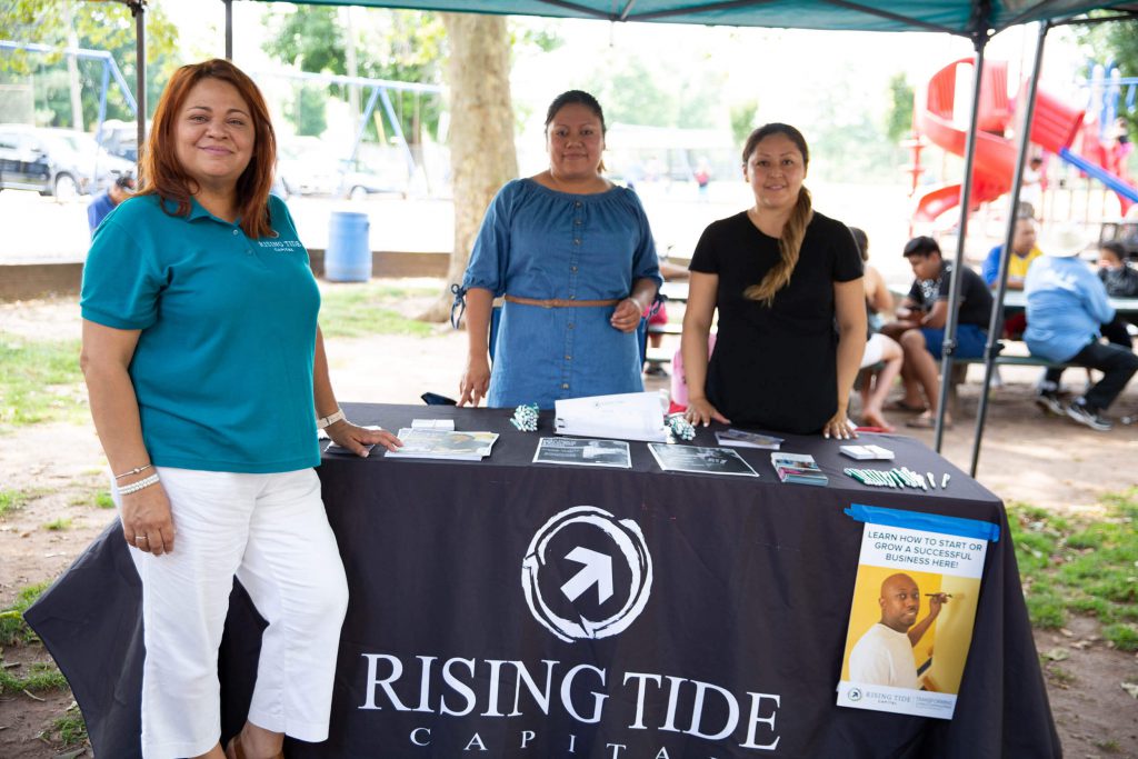 Business women working at a promotional booth.