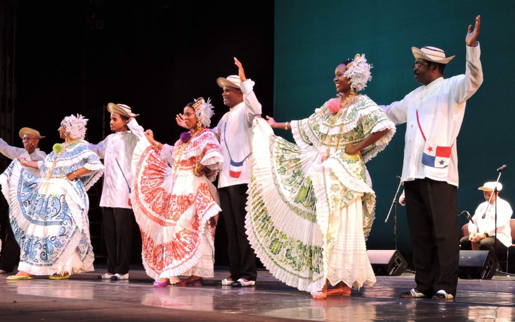 Performers dancing onstage.