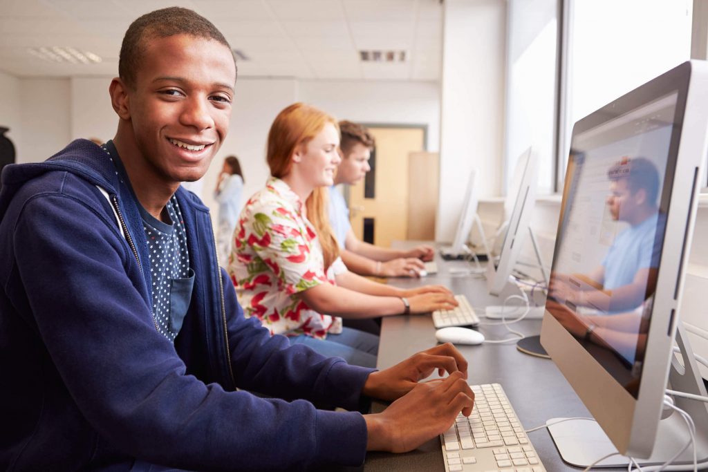 Students taking courses in a computer lab.