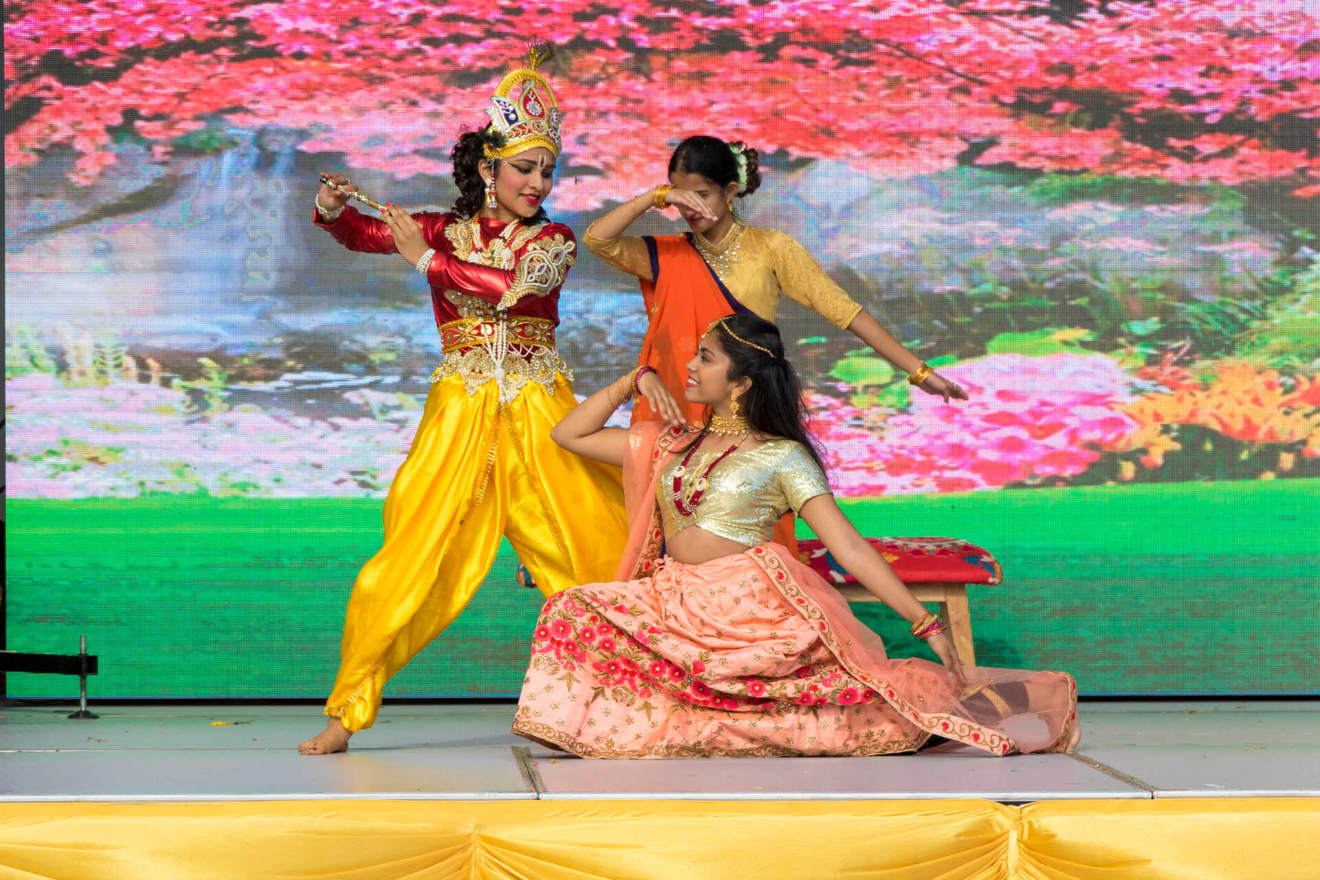 Indian American dancers performing at a festival.
