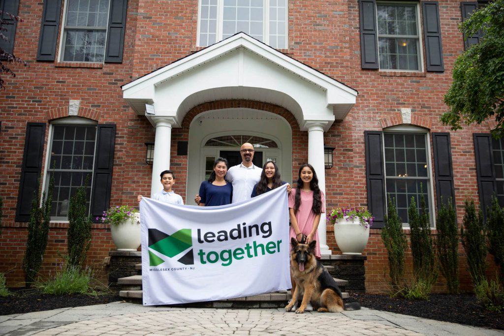 The Bajwa family together infront of their house. 