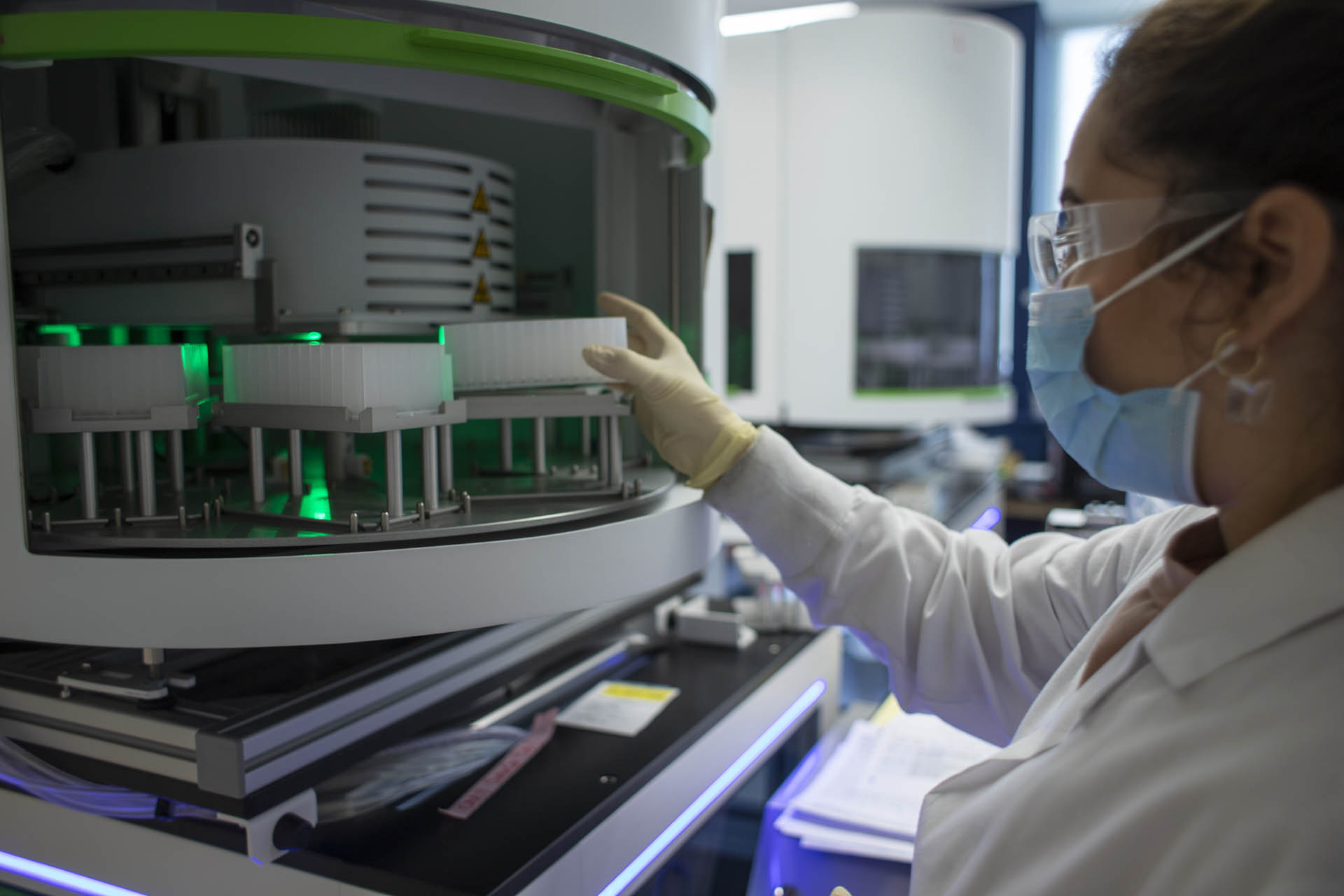 A laboratory researcher works with scientific equipment.