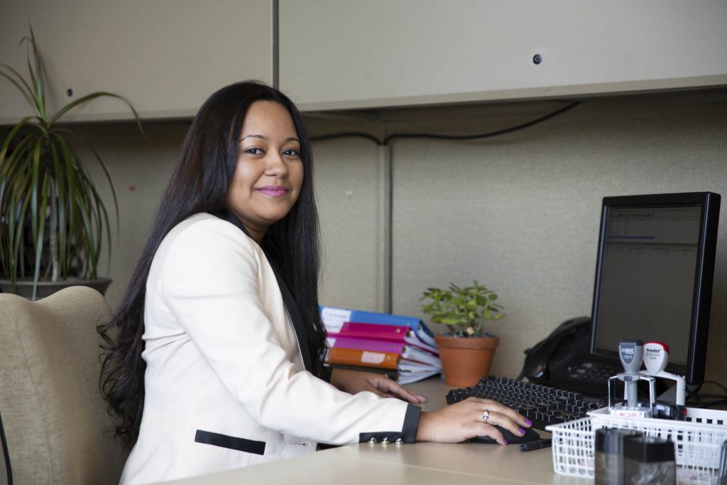 An office worker working on a computer.