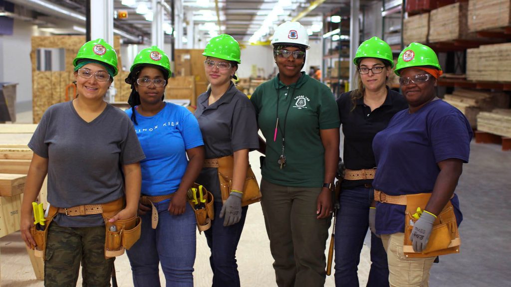 Students learning carpentry at a middlesex county school.